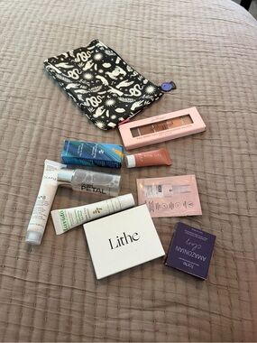 Mystery makeup bag with 5-8 pieces of new sealed, unexpired pieces of makeup